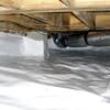 Bare floor joists in a sealed, insulated crawl space in Daytona Beach.