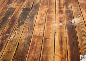 A Apopka wood floor displaying water damage.
