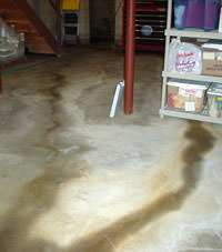 Flooding entering a basement through a floor crack in Sanford