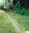 A recessed gutter drain extension installed in Gretna, Florida